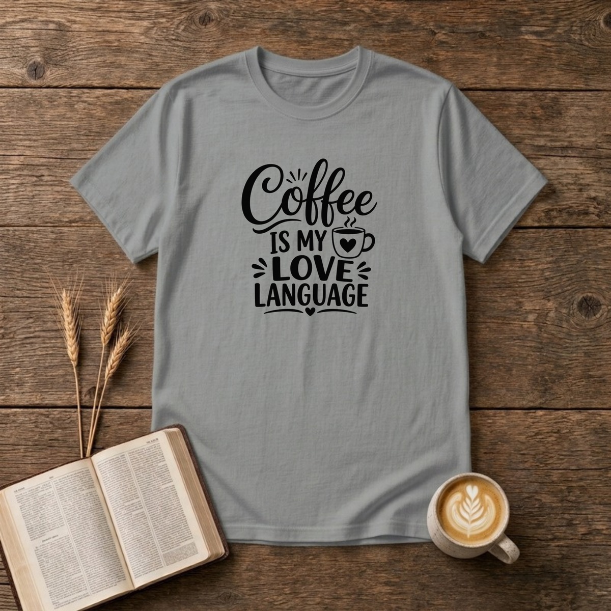 Coffee Is My Love Language design with black hand-lettered text and a heart-patterned coffee cup on a Sport Grey unisex T-Shirt