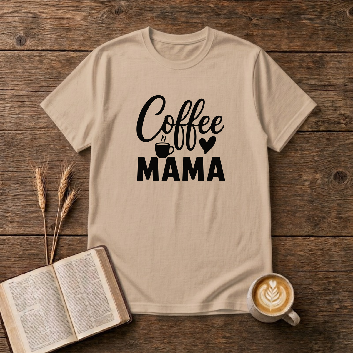 Coffee Mama design with black script and block lettering with a small coffee mug and a heart on a Natural unisex T-Shirt
