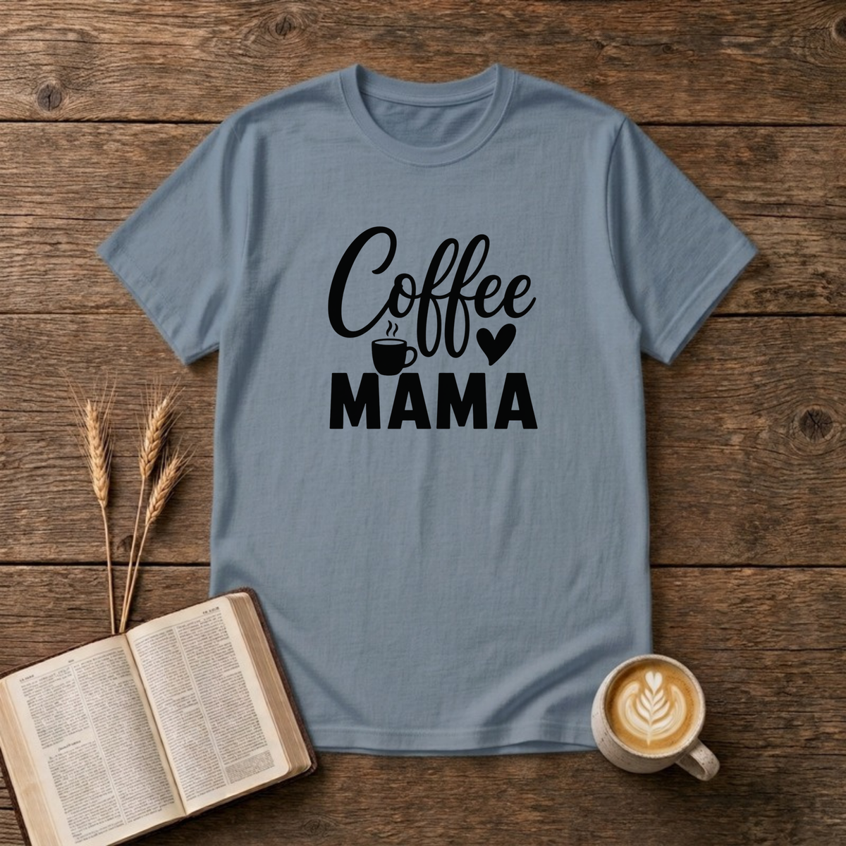 Coffee Mama design with black script and block lettering with a small coffee mug and a heart on a Stone Blue unisex T-Shirt