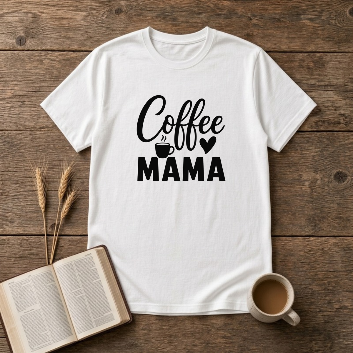 Coffee Mama design with black script and block lettering with a small coffee mug and a heart on a White unisex T-Shirt