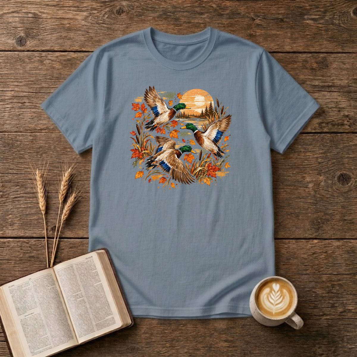 Ducks at Sunset design with three mallard ducks in flight over autumn leaves, golden reeds and a sunset on a Stone Blue unisex T-Shirt