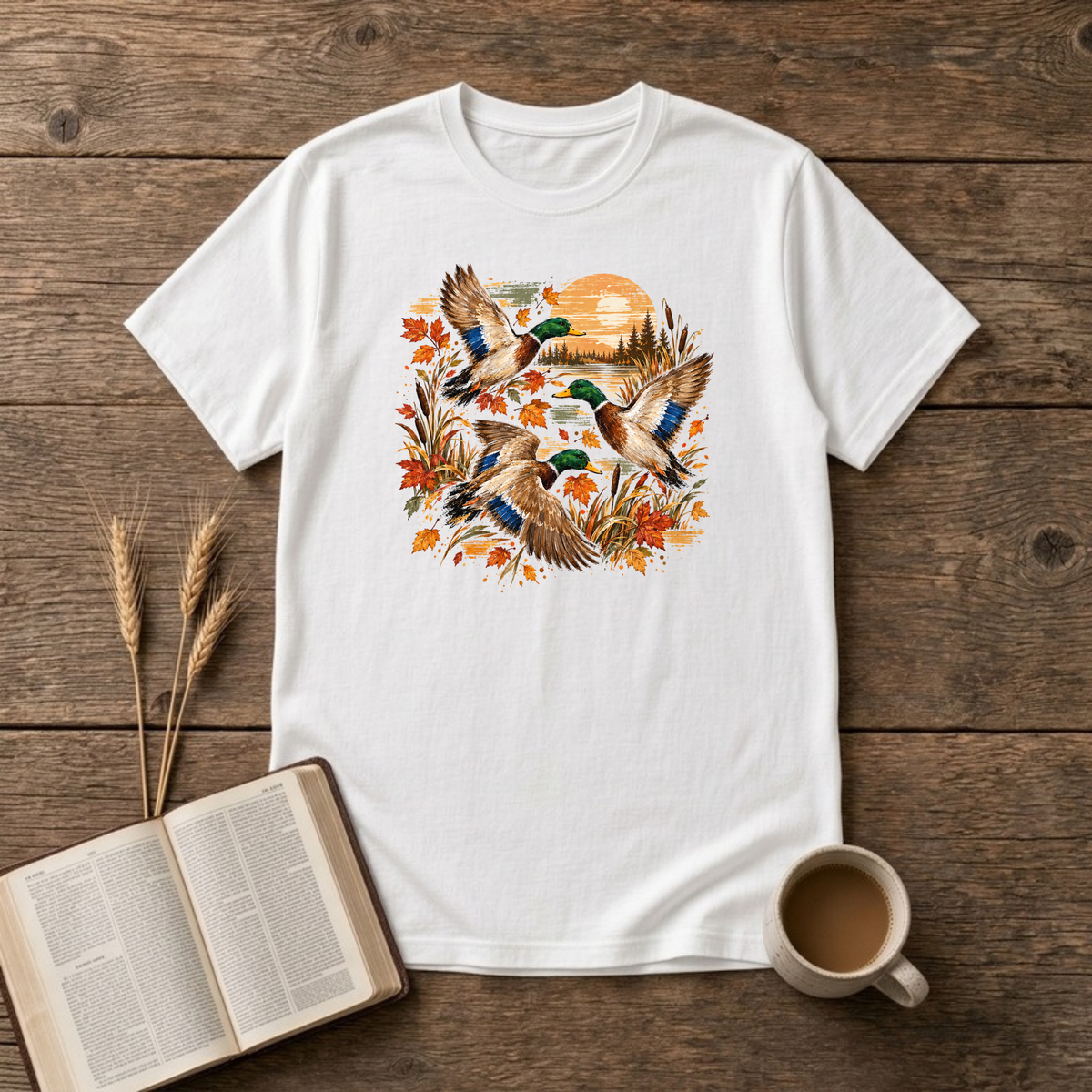 Ducks at Sunset design with three mallard ducks in flight over autumn leaves, golden reeds and a sunset on a White unisex T-Shirt
