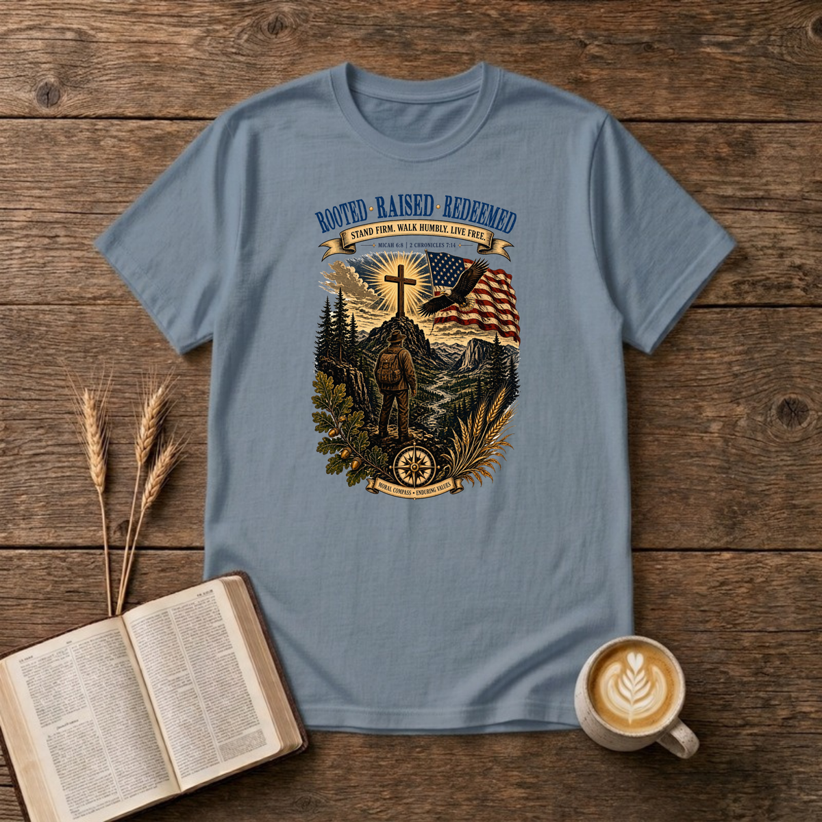 Rooted. Raised. Redeemed. mountain scene with a hiker, cross, waving flag and eagle on a Stone Blue unisex T-Shirt