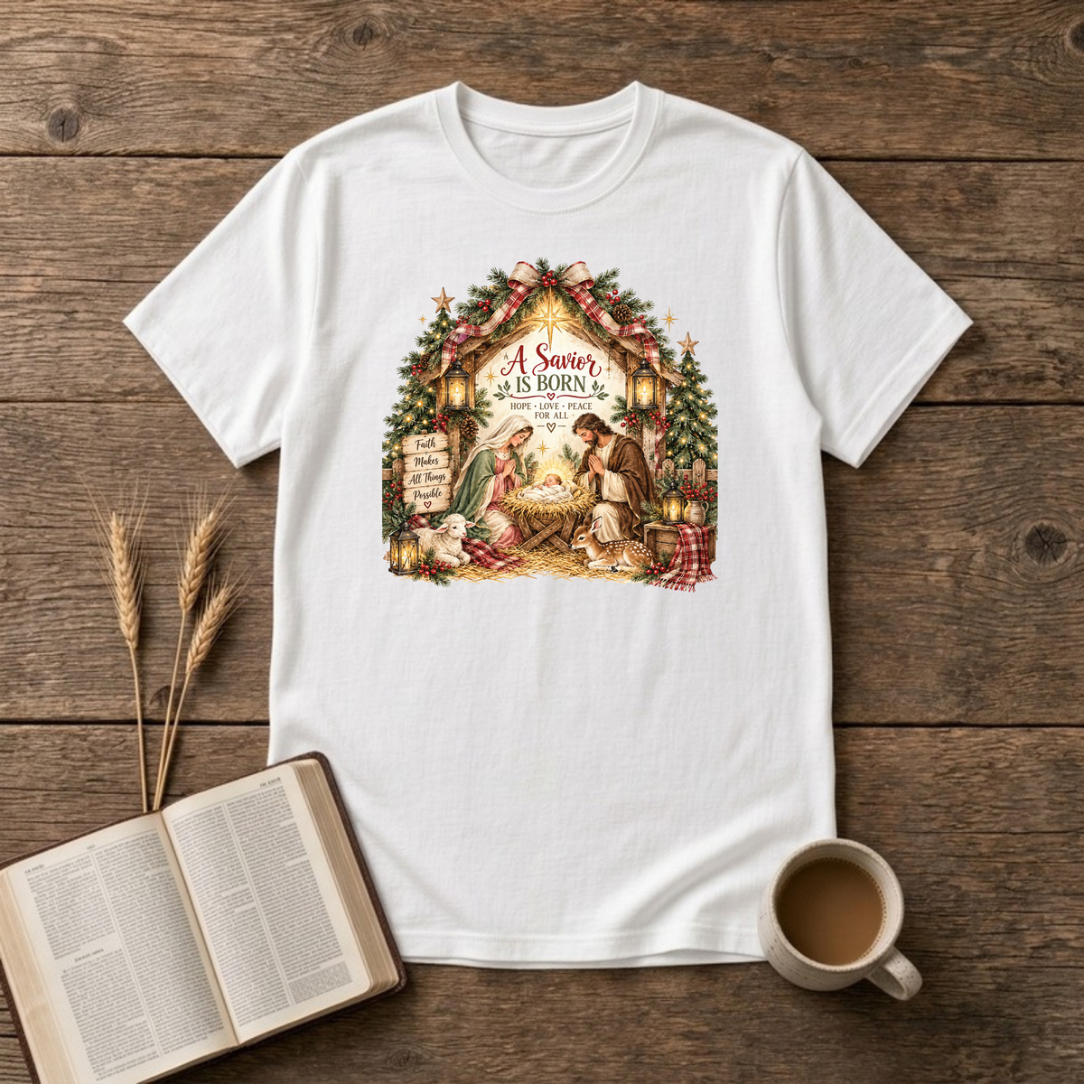A Savior Is Born manger nativity design of Mary, Joseph and baby Jesus in a wooden stable with a lamb, lanterns and Christmas trees on a White unisex T-Shirt