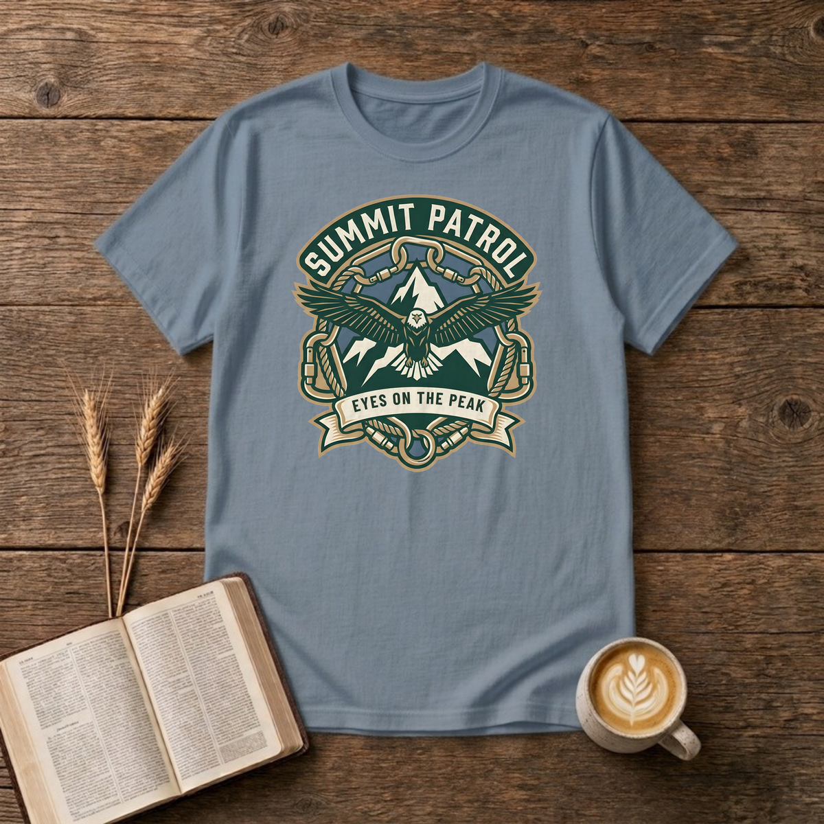 Summit Patrol design with an eagle, snow peaks and a ribbon reading Eyes On The Peak on a Stone Blue unisex T-Shirt.