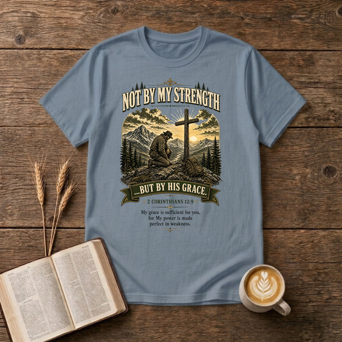 Mountain scene with a wooden cross and the words Not By My Strength on a Stone Blue unisex T-Shirt