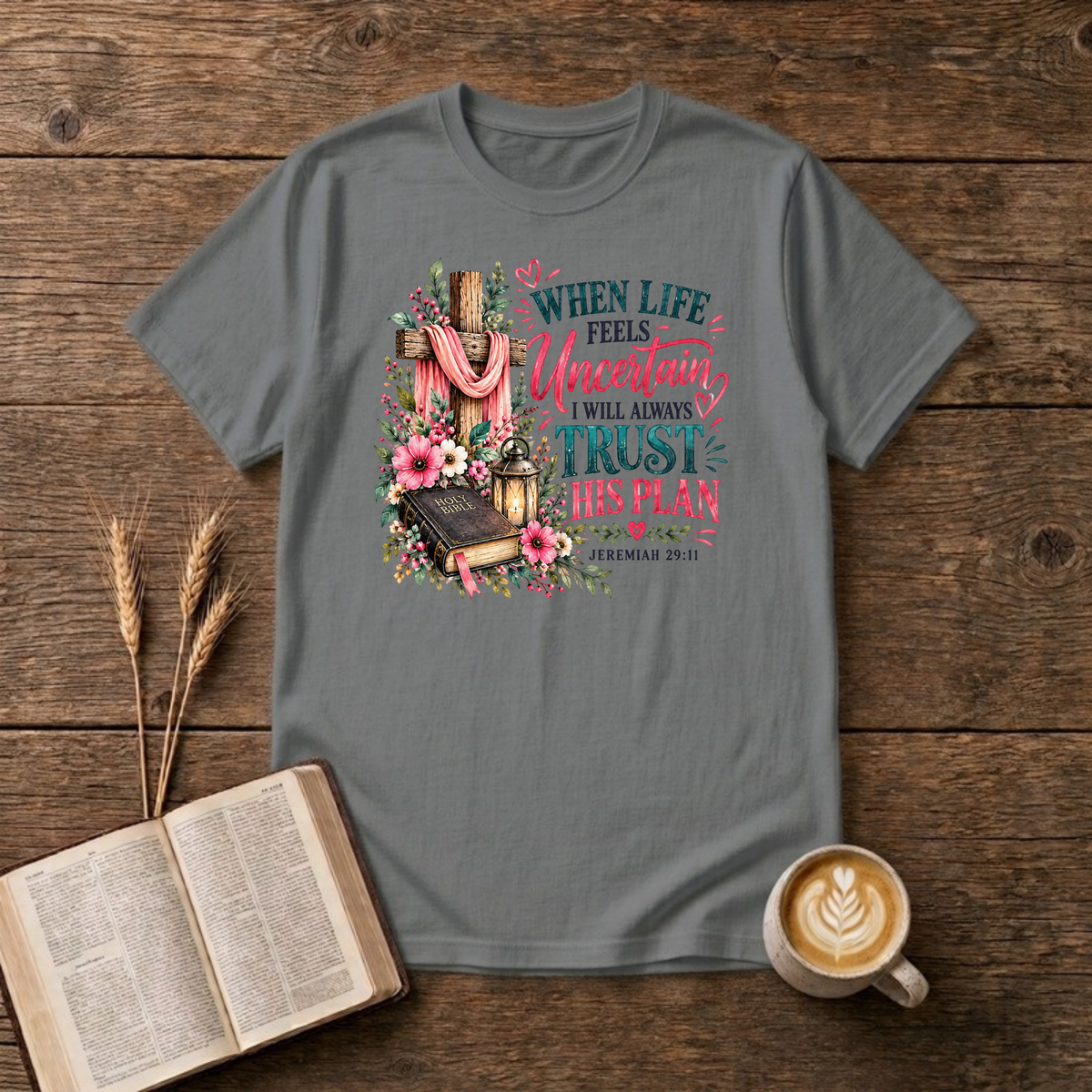 When Life Feels Uncertain T-Shirt in Graphite Heather, Jeremiah 29:11 wooden cross with pink flowers and Bible faith graphic