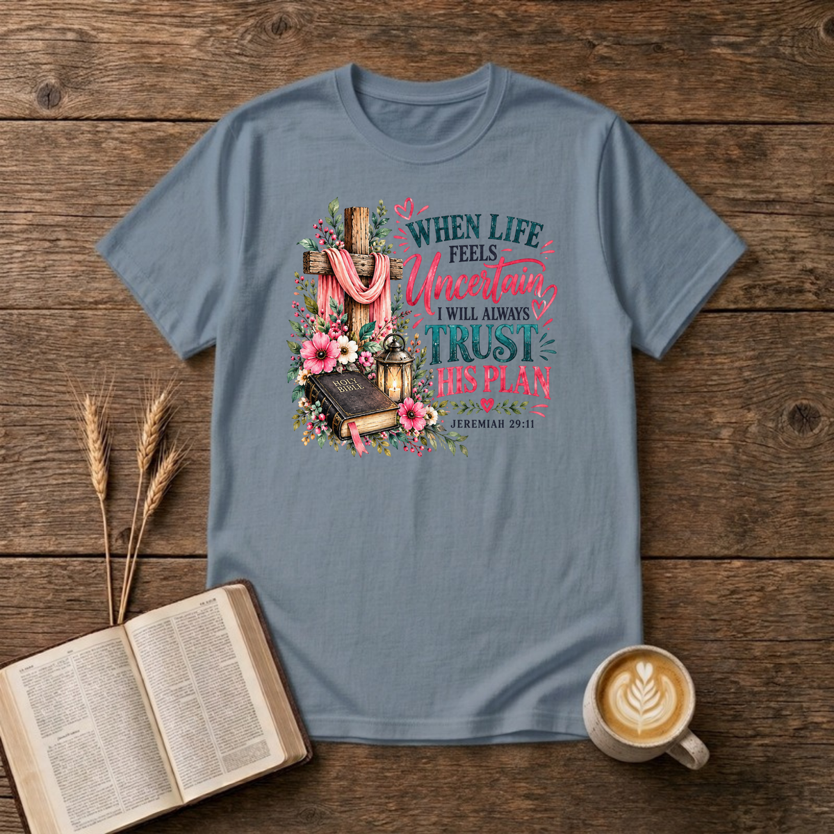 When Life Feels Uncertain T-Shirt in Stone Blue, Jeremiah 29:11 wooden cross with pink flowers and Bible faith graphic