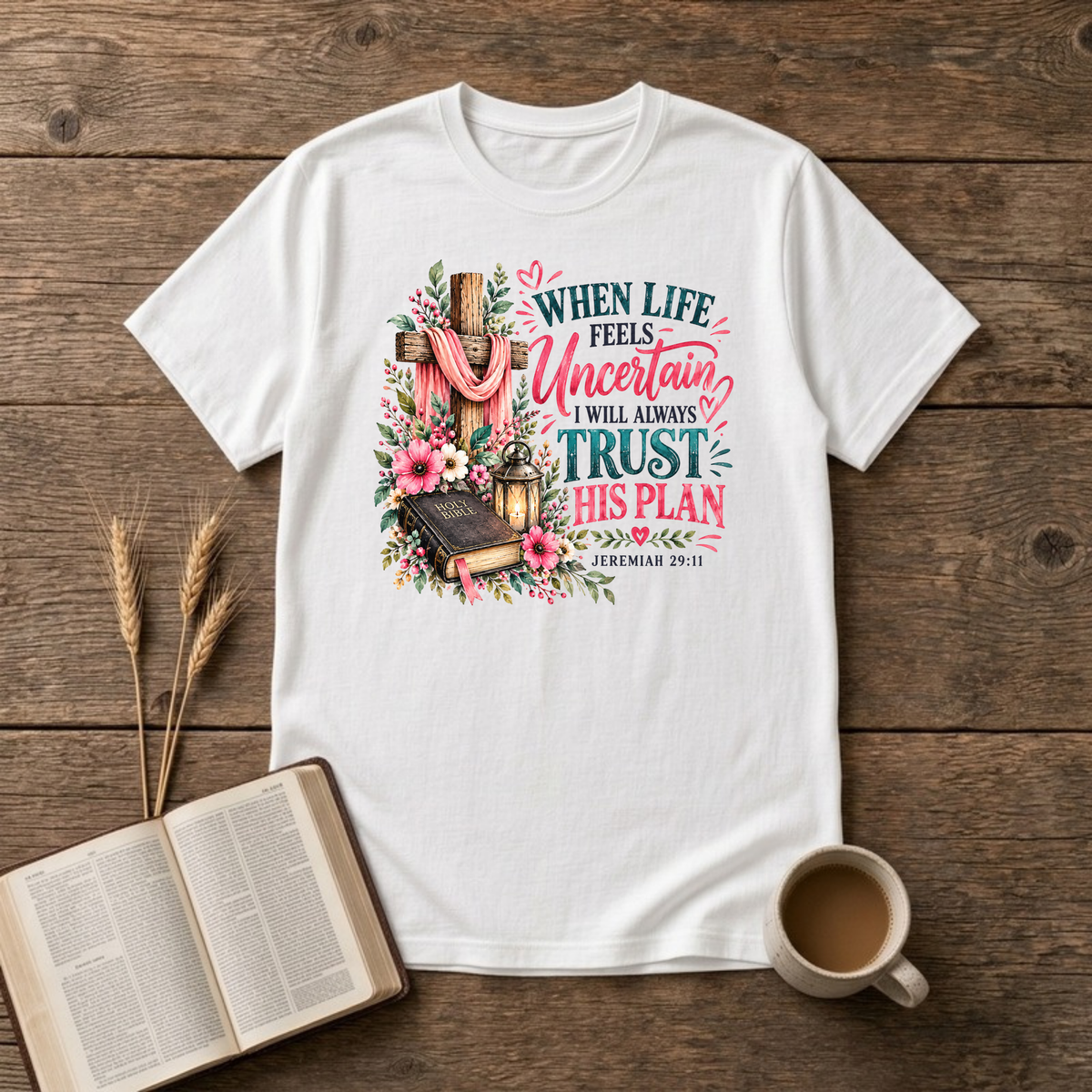 When Life Feels Uncertain T-Shirt in White, Jeremiah 29:11 wooden cross with pink flowers and Bible faith graphic